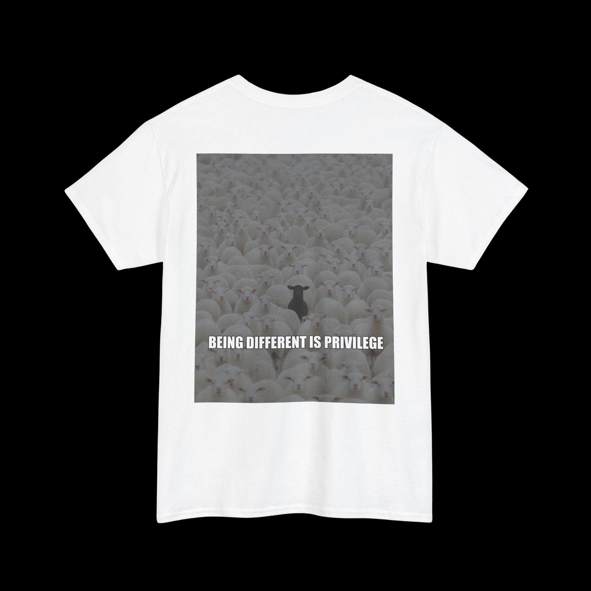 White t-shirt featuring a graphic of a single black sheep in a flock of white sheep, with the text "BEING DIFFERENT IS PRIVILEGE" displayed below. A statement about individuality.