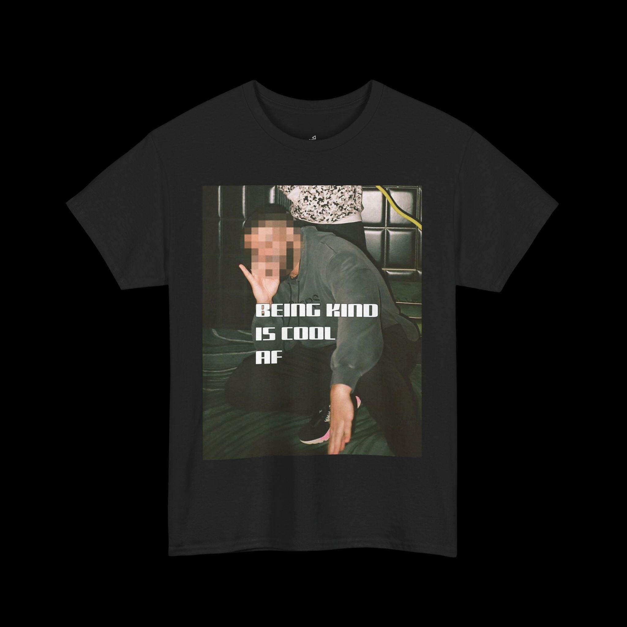 Black "BEING KIND IS COOL AF" t-shirt with a blurred person graphic, promoting a cool and positive message for unisex fashion.