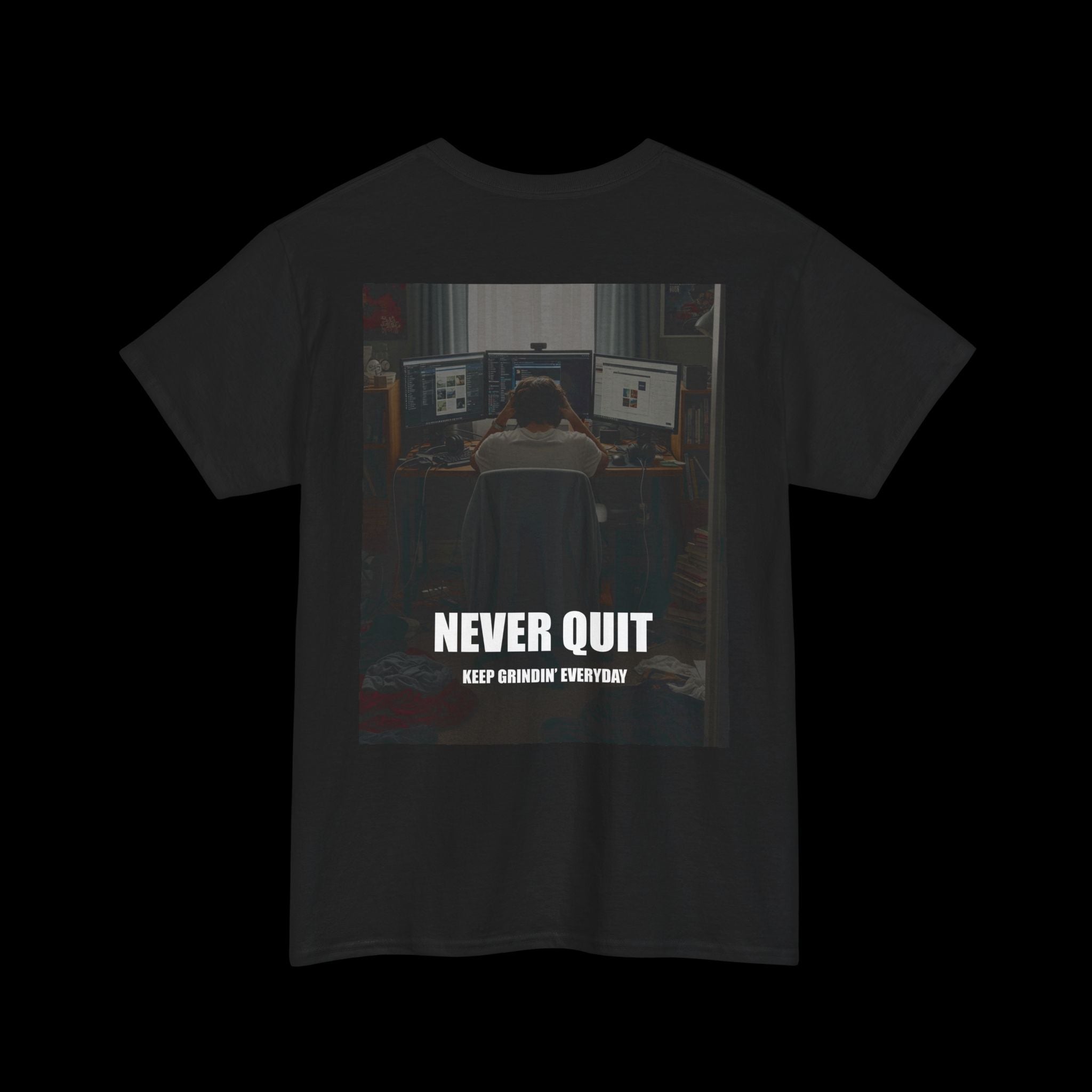 Black t-shirt with an inspiring graphic of a person dedicated to their work at a computer, displaying the text "NEVER QUIT KEEP GRINDIN' EVERYDAY". Great for motivation and perseverance.