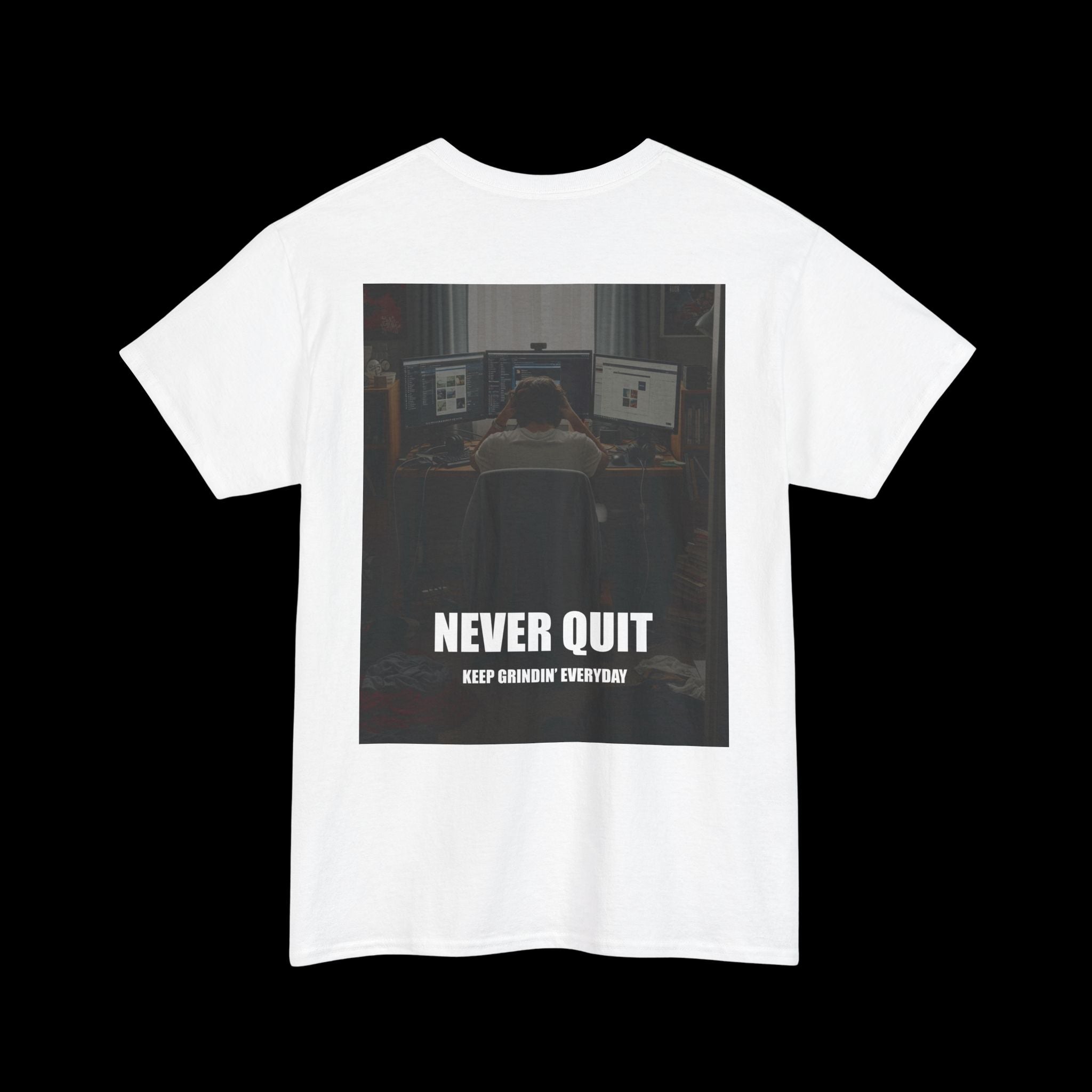 White t-shirt featuring a motivational graphic of someone working at a computer with the text "NEVER QUIT KEEP GRINDIN' EVERYDAY". Ideal for those with a strong work ethic.