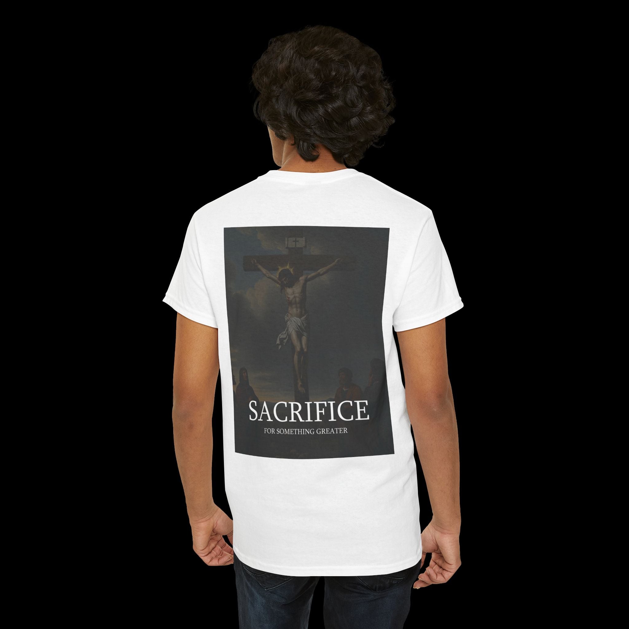 ack view of a white t-shirt featuring the bold text "SACRIFICE" above a dark, dramatic graphic of a winged figure. Evokes themes of sacrifice and intensity in gothic or alternative fashion.