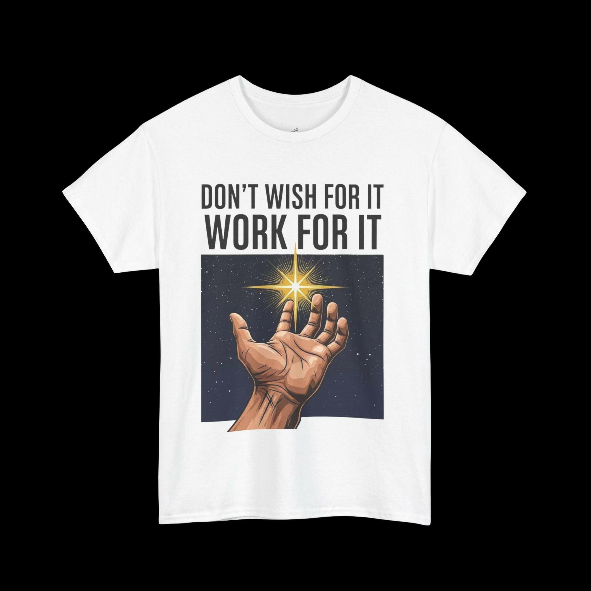 White t-shirt featuring the motivational quote "DON'T WISH FOR IT, WORK FOR IT" above a graphic of a hand reaching towards stars, inspiring hard work and ambition.